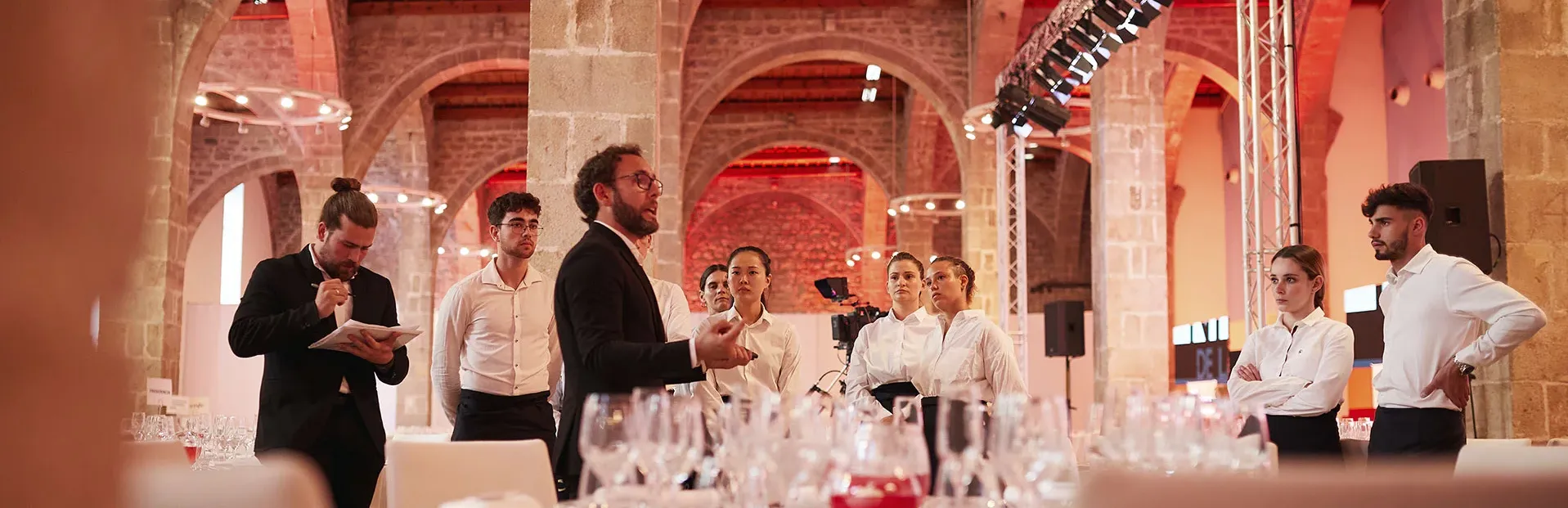 a man explaining things to hostesses