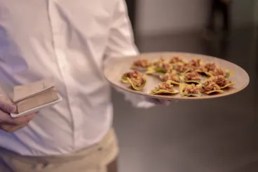 a man holding a plate of food